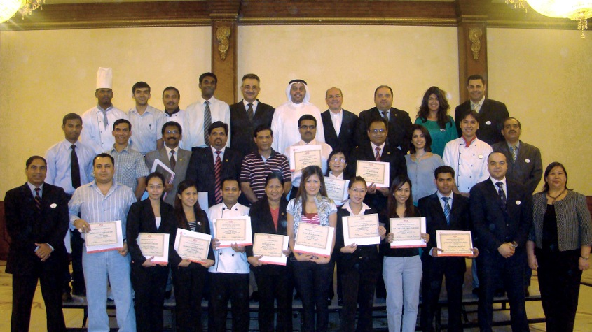 ITHC managers pose after finishing their Leadership Course in October 2010. Chairman Al-Tuwaijri is in the center, back row. Vic Alcuaz is to his left. Training partner Anabelle Ochoa is far right, first row.